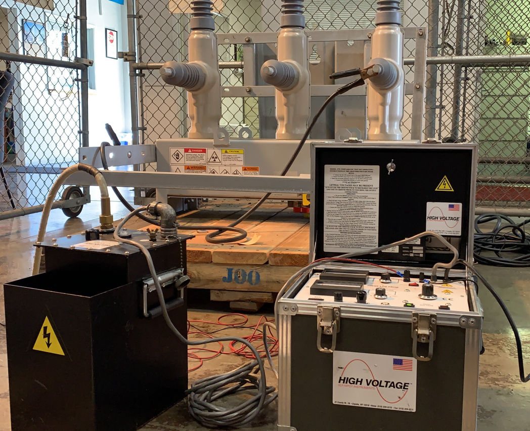 K1 Electric high-voltage test set connected to switchgear during acceptance testing